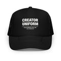 Black trucker cap with Creator Uniform logo on a white background