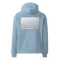 Light blue oversized hoodie with text on the back calm brings clarity