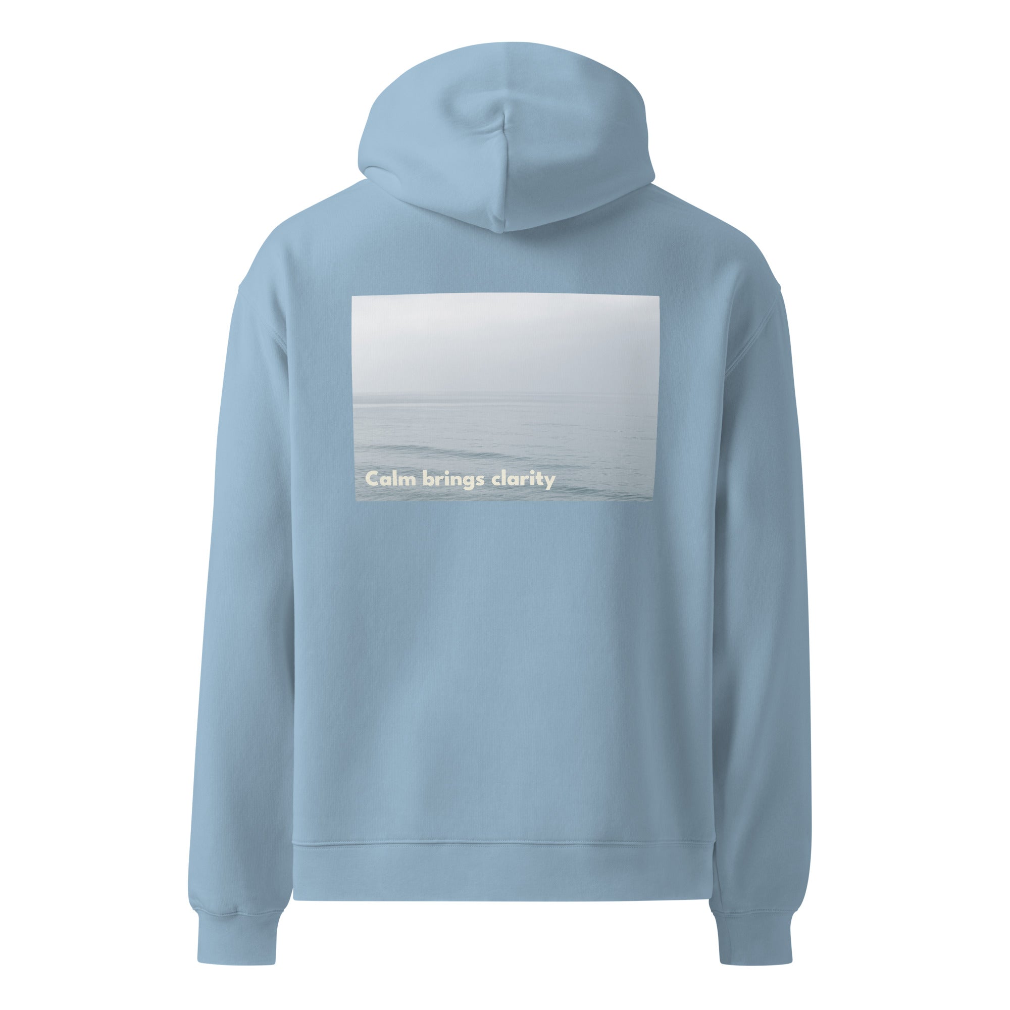 Light blue oversized hoodie with text on the back calm brings clarity