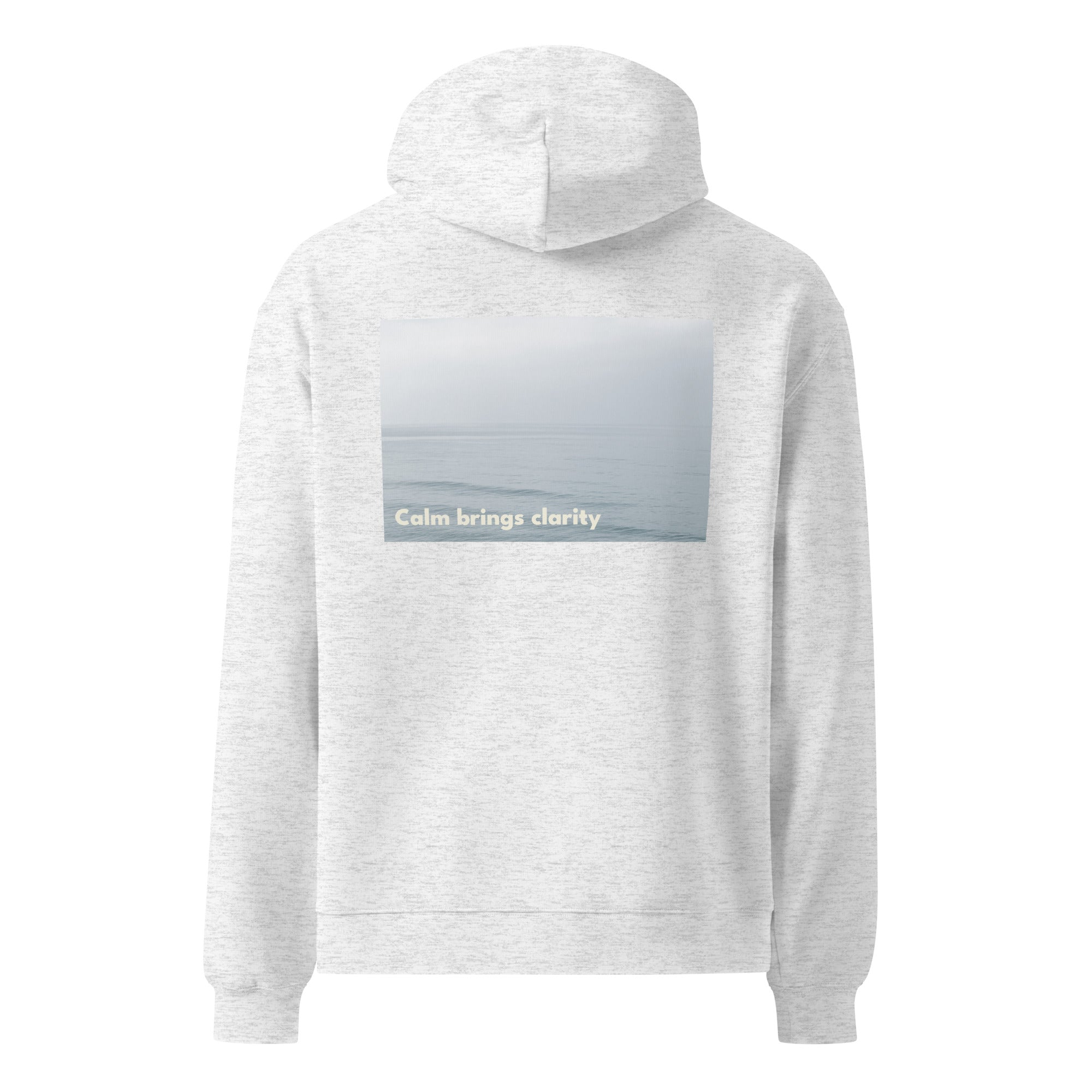 Malibu-Calm hoodie featuring soft ocean wave photography and the words “Calm brings clarity”
