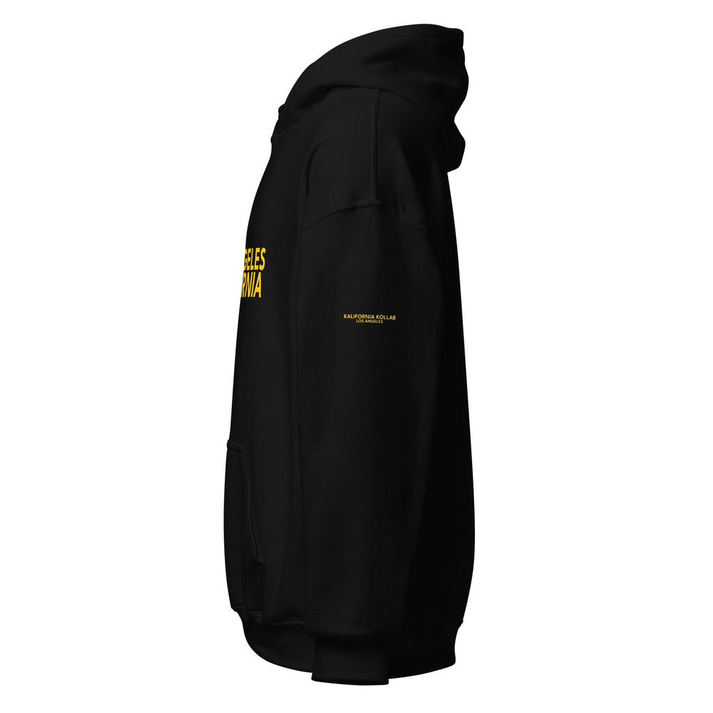 Minimalist LA streetwear hoodie in black with bold yellow lettering